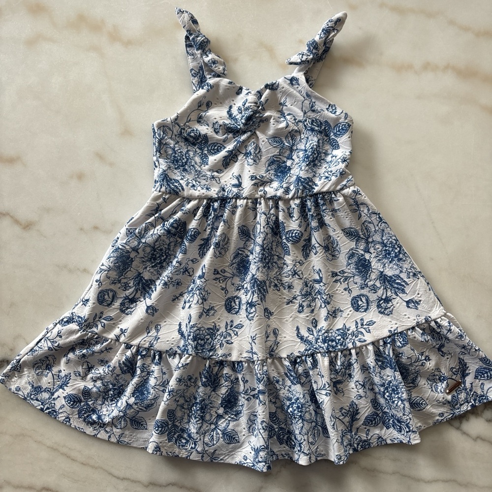 Blue and white floral babydoll dress with ruffles and tie straps. Size: 4 years - Picture 1 of 3